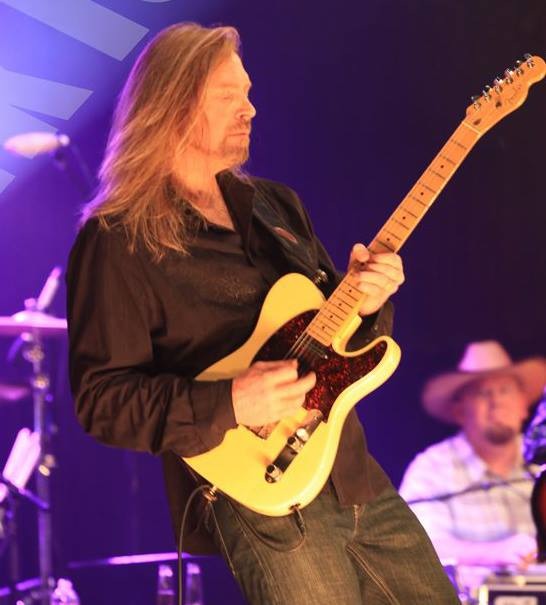 Mark Tokach performing live on guitar